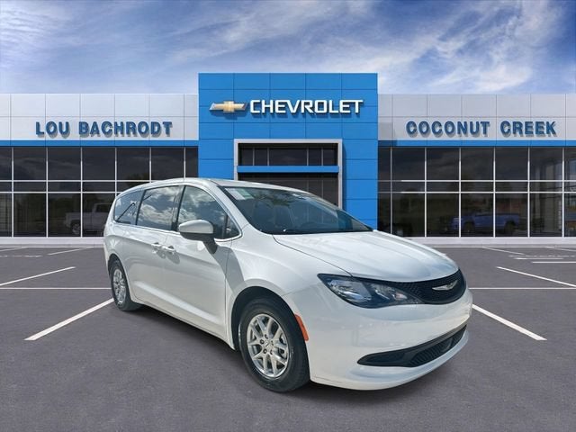 2023 Chrysler Voyager LX in Bright White Cl — front three-quarter view