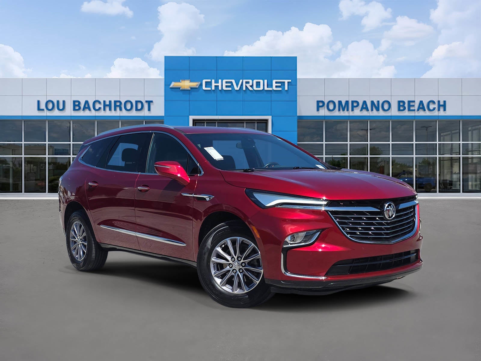 2024 Buick Enclave Essence in Cherry Red Tintcoat — front three-quarter view